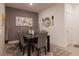 Elegant dining room with a modern table set, stylish decor, and neutral color palette at 226 Callen Falls Ave # 1311, Henderson, NV 89011