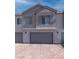 Charming townhome featuring a private garage and modern exterior design, offering convenience and style at 226 Callen Falls Ave # 1311, Henderson, NV 89011