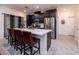 Well-appointed kitchen with a center island, dark cabinetry, stainless steel appliances, and barstool seating at 226 Callen Falls Ave # 1311, Henderson, NV 89011