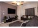 Comfortable living room with a sectional sofa, mounted TV, and stylish decor, perfect for relaxation at 226 Callen Falls Ave # 1311, Henderson, NV 89011