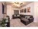 Cozy living room featuring a large sectional sofa, plush carpet, and themed wall art at 226 Callen Falls Ave # 1311, Henderson, NV 89011