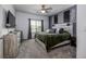 Serene bedroom with a ceiling fan, neutral tones, and a modern rustic aesthetic at 226 Callen Falls Ave # 1311, Henderson, NV 89011