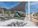 Community playground featuring shade covers, climbing structures, and multiple slides at 226 Callen Falls Ave # 1311, Henderson, NV 89011