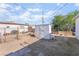 The backyard has a utility shed and a chain link fence at 2532 Arrowhead St, North Las Vegas, NV 89030