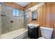 This bathroom features a bathtub with stone walls and a modern vanity at 2532 Arrowhead St, North Las Vegas, NV 89030