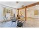 Bedroom with tile floors, furniture, and a cozy seating area to relax at 2532 Arrowhead St, North Las Vegas, NV 89030