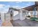 View of house exterior with gate and covered parking at 2532 Arrowhead St, North Las Vegas, NV 89030