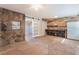 Living room with rock accent walls and sliding door at 2532 Arrowhead St, North Las Vegas, NV 89030