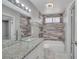 Bathroom featuring a glass vessel sink, granite countertop, and modern tiled walls at 2880 Placita Ct, Las Vegas, NV 89121
