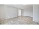 Expansive main bedroom featuring herringbone floors, walk in closet, and a window at 2880 Placita Ct, Las Vegas, NV 89121