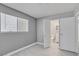 Bedroom featuring wood look flooring, a window, and ensuite bathroom access at 2880 Placita Ct, Las Vegas, NV 89121