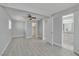 Bedroom features wood look flooring, ceiling fan, and ensuite bathroom access at 2880 Placita Ct, Las Vegas, NV 89121