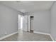 Simple bedroom featuring tile floors, closet, and neutral walls at 2880 Placita Ct, Las Vegas, NV 89121