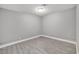 Clean, minimalist bedroom with tile flooring and neutral paint at 2880 Placita Ct, Las Vegas, NV 89121