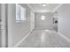 Foyer with porcelain tile flooring and octagonal window at 2880 Placita Ct, Las Vegas, NV 89121