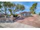 Charming single-story home featuring mature trees and a wide driveway at 2880 Placita Ct, Las Vegas, NV 89121