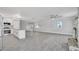 Open-concept living room featuring tile floors and a stone fireplace at 2880 Placita Ct, Las Vegas, NV 89121