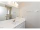 Bright bathroom featuring a white vanity, modern fixtures, and a large mirror at 2924 Pleasant Lake Dr, Las Vegas, NV 89117