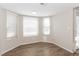 Bright bathroom with wood-look floors, featuring natural light from multiple windows at 2924 Pleasant Lake Dr, Las Vegas, NV 89117
