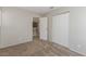 Carpeted bedroom with open access to the hallway and a double-door closet at 2924 Pleasant Lake Dr, Las Vegas, NV 89117