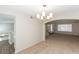 Open-concept dining room showcasing stylish lighting and seamless flow to the kitchen at 2924 Pleasant Lake Dr, Las Vegas, NV 89117