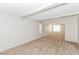 Bright living room featuring neutral walls, plush carpeting, and ceiling beams at 2924 Pleasant Lake Dr, Las Vegas, NV 89117