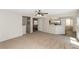 Spacious living room featuring neutral paint, ceiling fan and view to staircase at 2924 Pleasant Lake Dr, Las Vegas, NV 89117