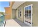 A well-lit outdoor balcony offering room to relax with a glass door leading back into the home at 30 Strada Di Villaggio # 441, Henderson, NV 89011