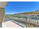 Balcony view overlooking a green space with walking trails, neighborhood, and mountains in the background at 30 Strada Di Villaggio # 441, Henderson, NV 89011