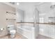 Clean, tiled bathroom featuring a shower, bath, and toilet showcases a functional and modern design at 30 Strada Di Villaggio # 441, Henderson, NV 89011