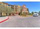 Elegant condo building featuring an inviting entrance and well-maintained landscaping at 30 Strada Di Villaggio # 441, Henderson, NV 89011