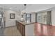 Open kitchen featuring stainless steel appliances, granite countertops and an adjacent living area at 30 Strada Di Villaggio # 441, Henderson, NV 89011