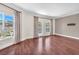 Bright living room boasts hardwood floors, large windows, and access to an outdoor balcony with great views at 30 Strada Di Villaggio # 441, Henderson, NV 89011