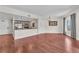 Open-concept living space with hardwood floors and a kitchen view at 30 Strada Di Villaggio # 441, Henderson, NV 89011