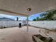 Covered back patio featuring a white brick fence, built-in grill, and an outdoor lighting fixture at 3112 Piedmont Ave, Las Vegas, NV 89102