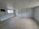 Finished basement with white paneling, tile floor, and a window for natural light at 3112 Piedmont Ave, Las Vegas, NV 89102