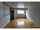 Bright bedroom with wood floors, closet, and a large window offering ample natural light at 3112 Piedmont Ave, Las Vegas, NV 89102