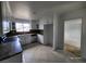 Well-lit kitchen with white cabinets, granite countertops, tile flooring, and stainless steel appliances at 3112 Piedmont Ave, Las Vegas, NV 89102