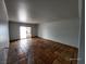 Spacious living room with terracotta tile flooring and access to the yard through a sliding glass door at 3112 Piedmont Ave, Las Vegas, NV 89102