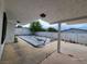 Covered swimming pool area in the backyard, surrounded by white walls and patio space at 3112 Piedmont Ave, Las Vegas, NV 89102