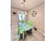 Dining room with a glass top table and unique lighting fixture at 3114 Molinos Dr, Las Vegas, NV 89141