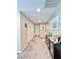 Hallway with neutral walls, carpeted flooring, multiple doors, and decor at 3114 Molinos Dr, Las Vegas, NV 89141