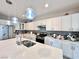 Bright kitchen with stainless steel appliances and white cabinets at 3114 Molinos Dr, Las Vegas, NV 89141