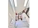 Entry way with staircase, neutral colored tile floors, two-story foyer with natural light and decor at 3114 Molinos Dr, Las Vegas, NV 89141