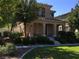 Charming two-story home featuring a covered porch, landscaped yard, and well-maintained front lawn at 3175 Obscured Light Walk, Henderson, NV 89044