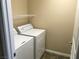 Convenient laundry room with a washer, dryer, and wire shelving at 3175 Obscured Light Walk, Henderson, NV 89044