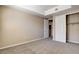 Spacious bedroom featuring neutral carpeting, closet, and ensuite bathroom access at 32 E Serene Ave # 207, Las Vegas, NV 89123