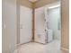 Spacious entryway leads to laundry area, showcasing tile flooring at 32 E Serene Ave # 207, Las Vegas, NV 89123