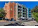 Modern condo building featuring balconies and on-site parking at 32 E Serene Ave # 207, Las Vegas, NV 89123
