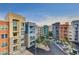 A colorful condo community featuring many units, balconies and dedicated parking at 32 E Serene Ave # 207, Las Vegas, NV 89123